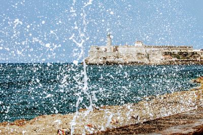 Sea waves splashing on rocks