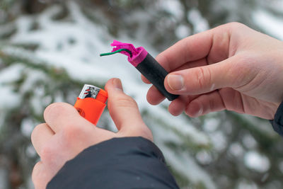 Cropped hand of person holding electronic cigarette