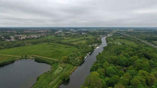 High angle view of green landscape against sky