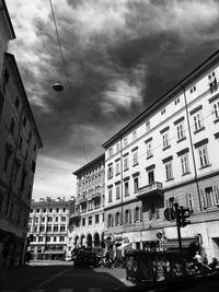 Low angle view of buildings in city against sky