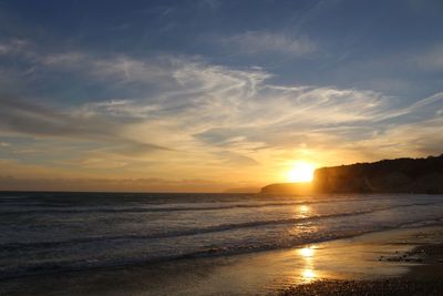 Scenic view of sea against sky during sunset