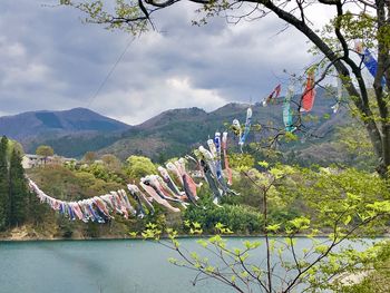 Scenic view of lake and mountains against sky