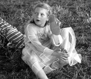 Girl sitting on field