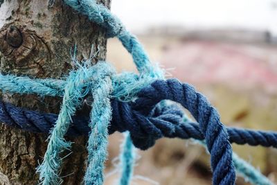 Close-up of rope tied on metal