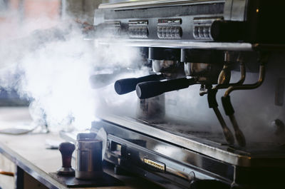 Close-up of smoke emitting from container