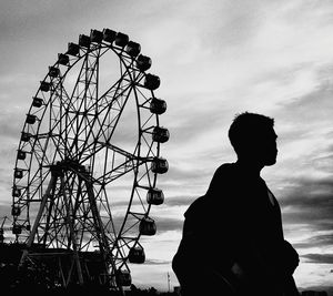 Low angle view of ferris wheel against sky