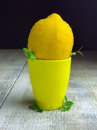 Close-up of yellow lemon on table