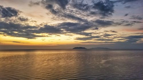 Scenic view of sea against sky at sunset