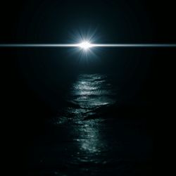 Scenic view of sea against sky at night
