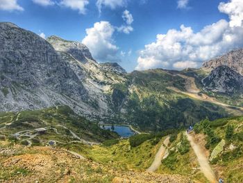 Scenic view of mountains against cloudy sky