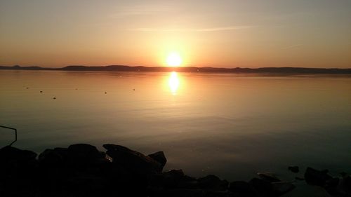 Scenic view of sunset over river