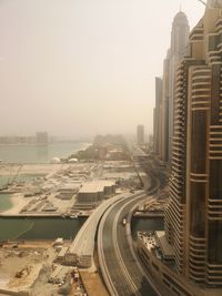 High angle view of buildings in city against sky