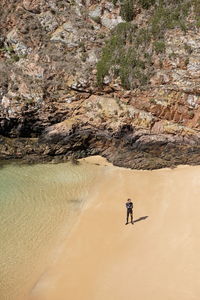 Rear view of man on rock