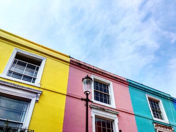 Low angle view of colorful building against sky