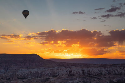 Hot air balloon against sky during sunset