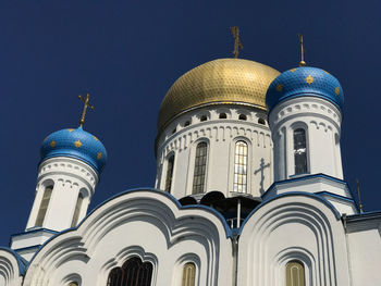 Low angle view of building against blue sky