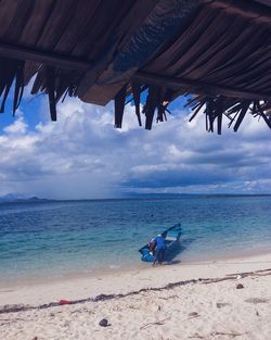 Man on beach against sky