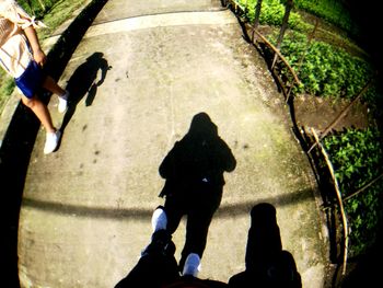 High angle view of people walking on road