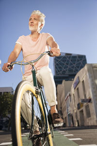 Mature man riding bicycle in the city