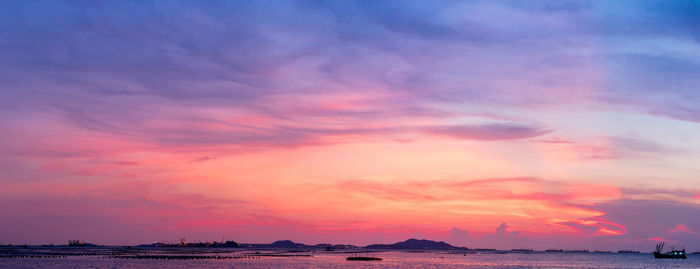 Scenic view of sea against sky at sunset