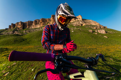 Side view of man riding bicycle
