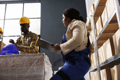 Rear view of man working at construction site