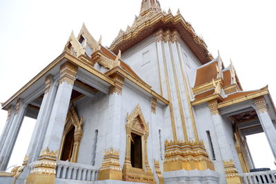 Low angle view of temple against building