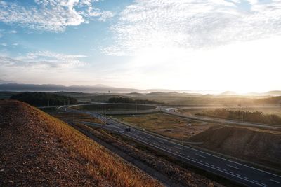 High angle view of railroad tracks against sky during sunset