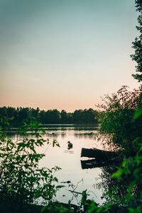 Scenic view of lake against sky during sunset