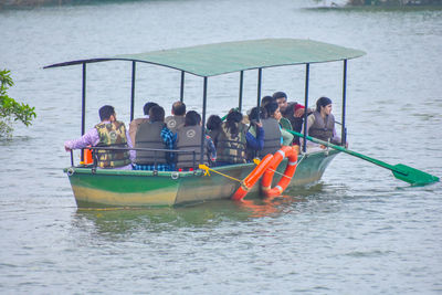 People in boat at lake