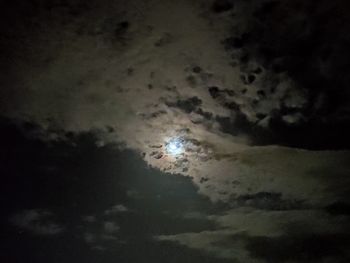 Low angle view of moon at sunset