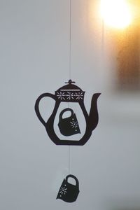 Close-up of information sign against sky