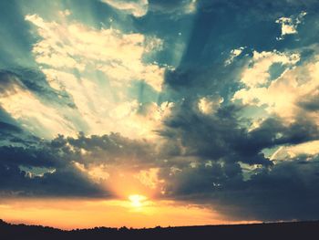 Sun shining through clouds