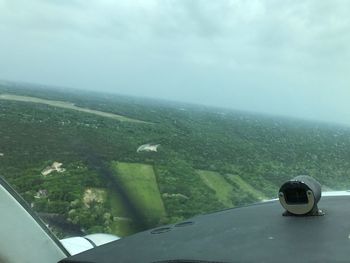 Airplane on sea against sky