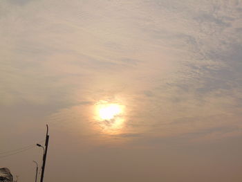 Low angle view of street light against sky during sunset
