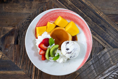 High angle view of fruits in plate on table