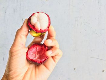 High angle view of hand holding ice cream