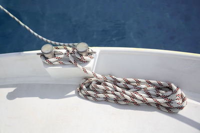 High angle view of rope tied yacht cleat