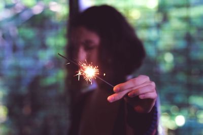 Woman holding sparkle