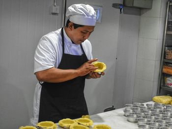 Midsection of man holding food