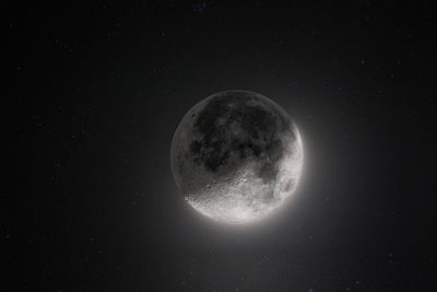 Low angle view of moon against sky at night