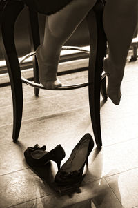 Low section of woman in high heels