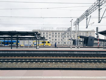 Train at railroad station against sky