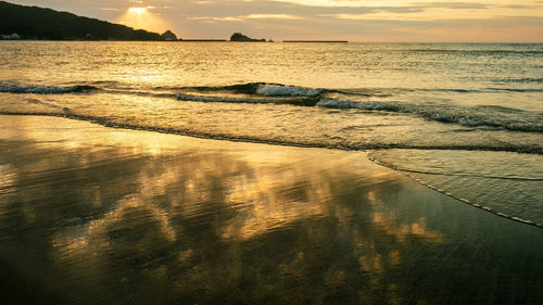 Scenic view of beach during sunset