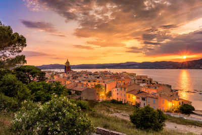 High angle view of saint-tropez against golden sky during mediterranean sunset
