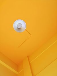 Low angle view of pendant light hanging on ceiling