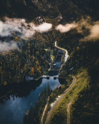 Aerial view of river amidst trees against sky