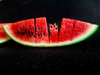 High angle view of fruit on table against black background