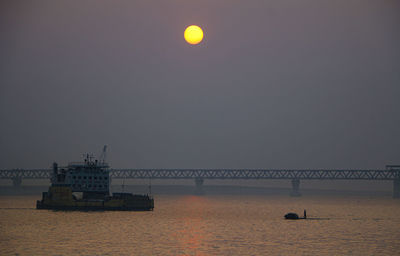 Scenic view of sea against clear sky during sunset