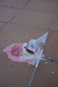 High angle view of pink petals on floor